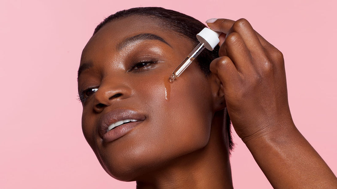 Woman applying facial serum